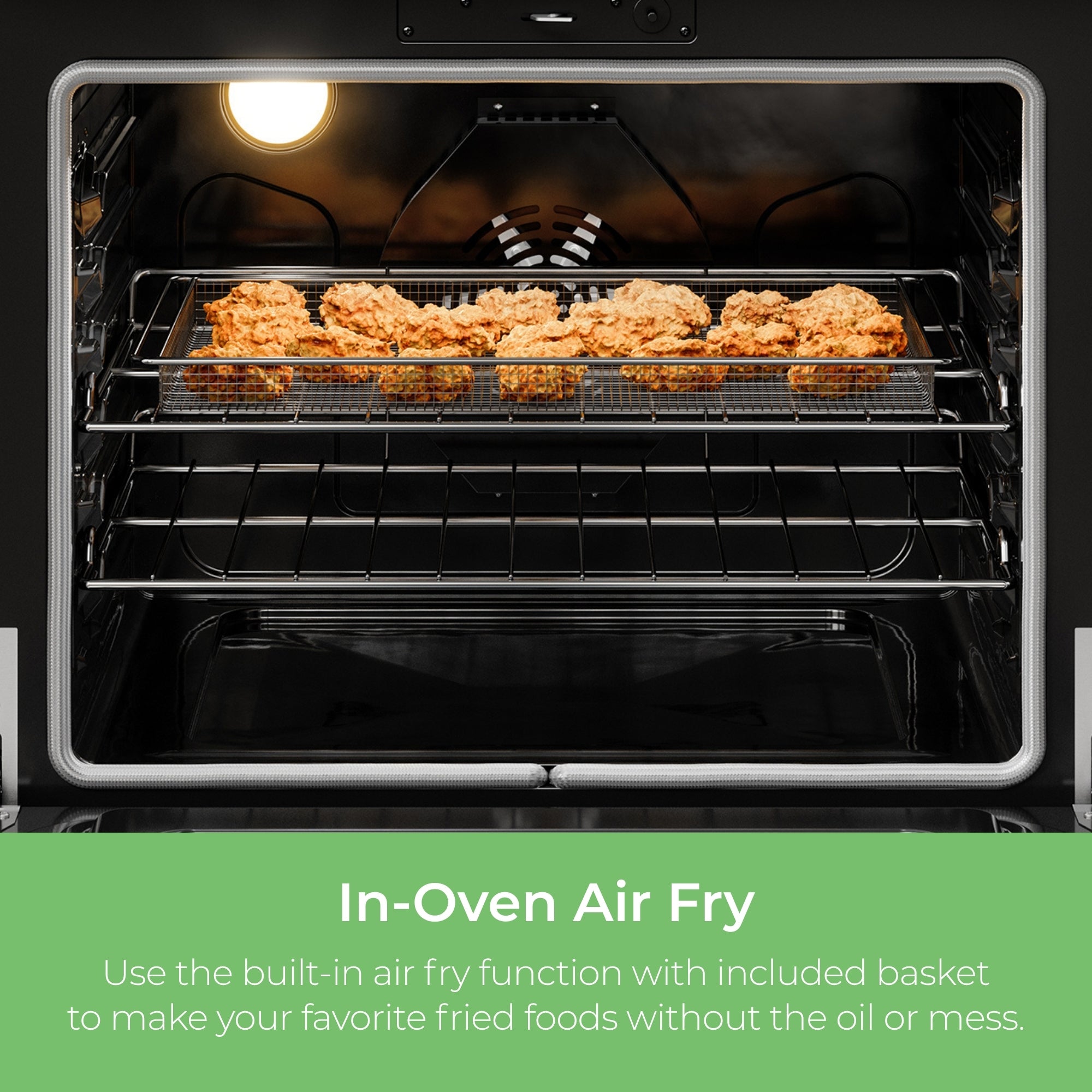 Closeup of the interior of the Kenmore stainless steel electric range with chicken wings in the airfryer basket inside. Text below reads, "In-Oven Air Fry: Use the built-in air fry function with included basket to make your favorite fried foods without the oil or mess."