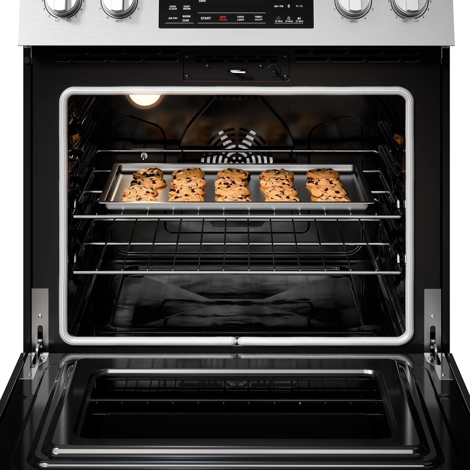 Closeup of the interior of the Kenmore stainless steel electric range with a tray of cookies inside