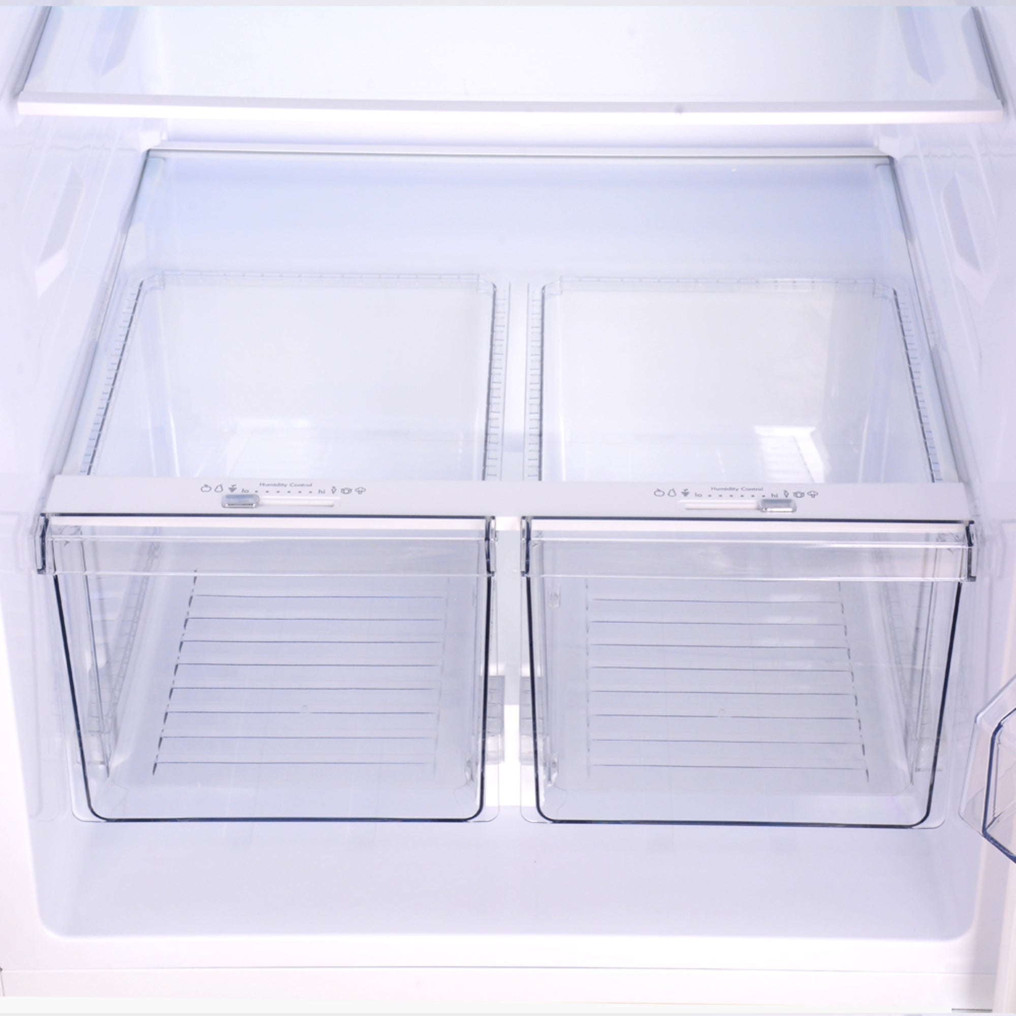 Closeup of the empty crispers in the Kenmore stainless steel top mount refrigerator
