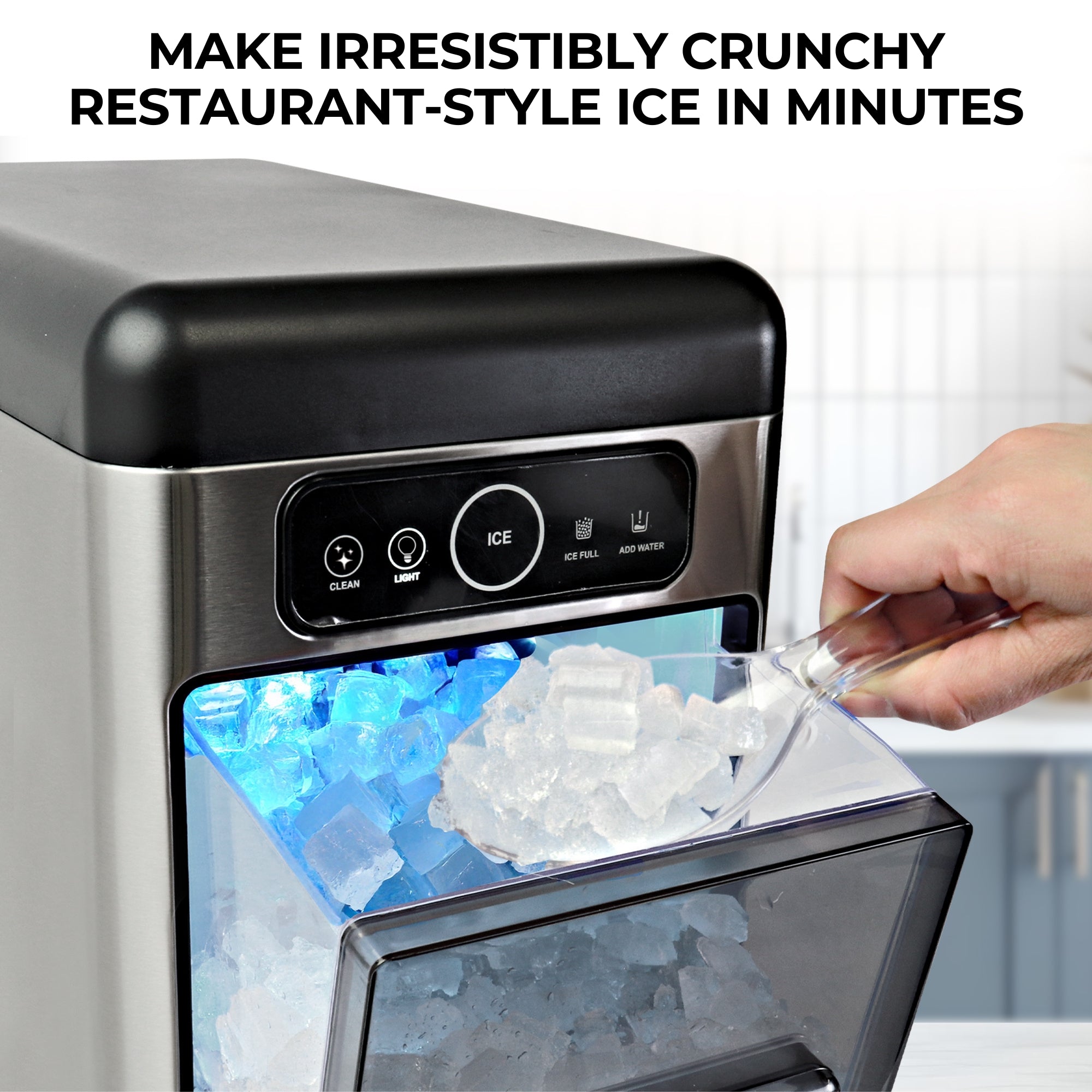 Closeup of the Kenmore space-saving front-load chewable nugget ice machine with the ice drawer pulled out and a person's hand scooping ice from it. Text above reads, "Make irresistibly crunchy restaurant-style ice in minutes."