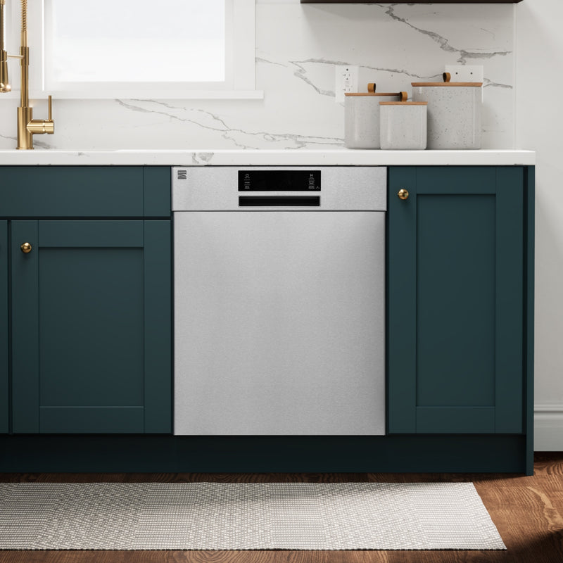 Kenmore stainless steel dishwasher installed in a bright kitchen with dark green cabinets