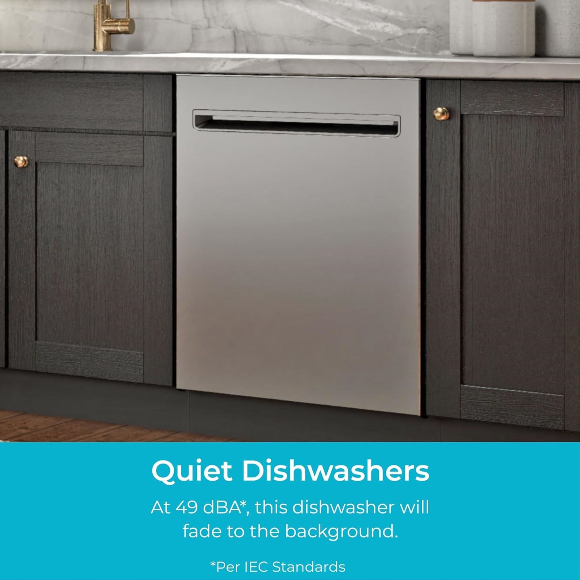 Kenmore stainless steel dishwasher installed in a bright kitchen with dark gray cabinets. Text below reads, "Quiet Dishwashers: At 49 dBA*, this dishwasher will fade to the background (*Per IEC Standards)."