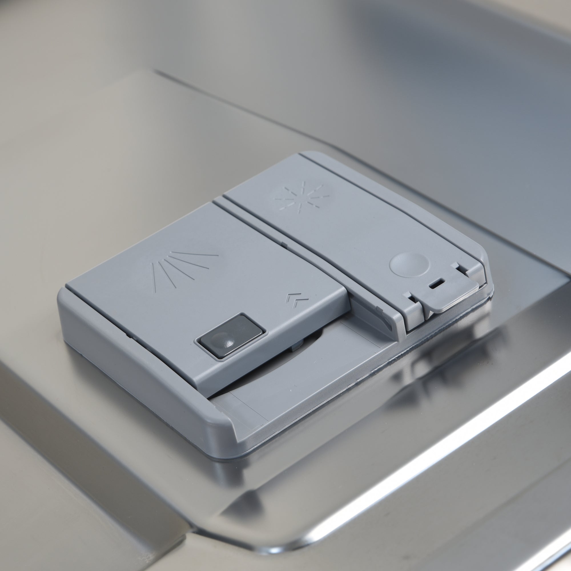 Closeup of the closed detergent compartment
