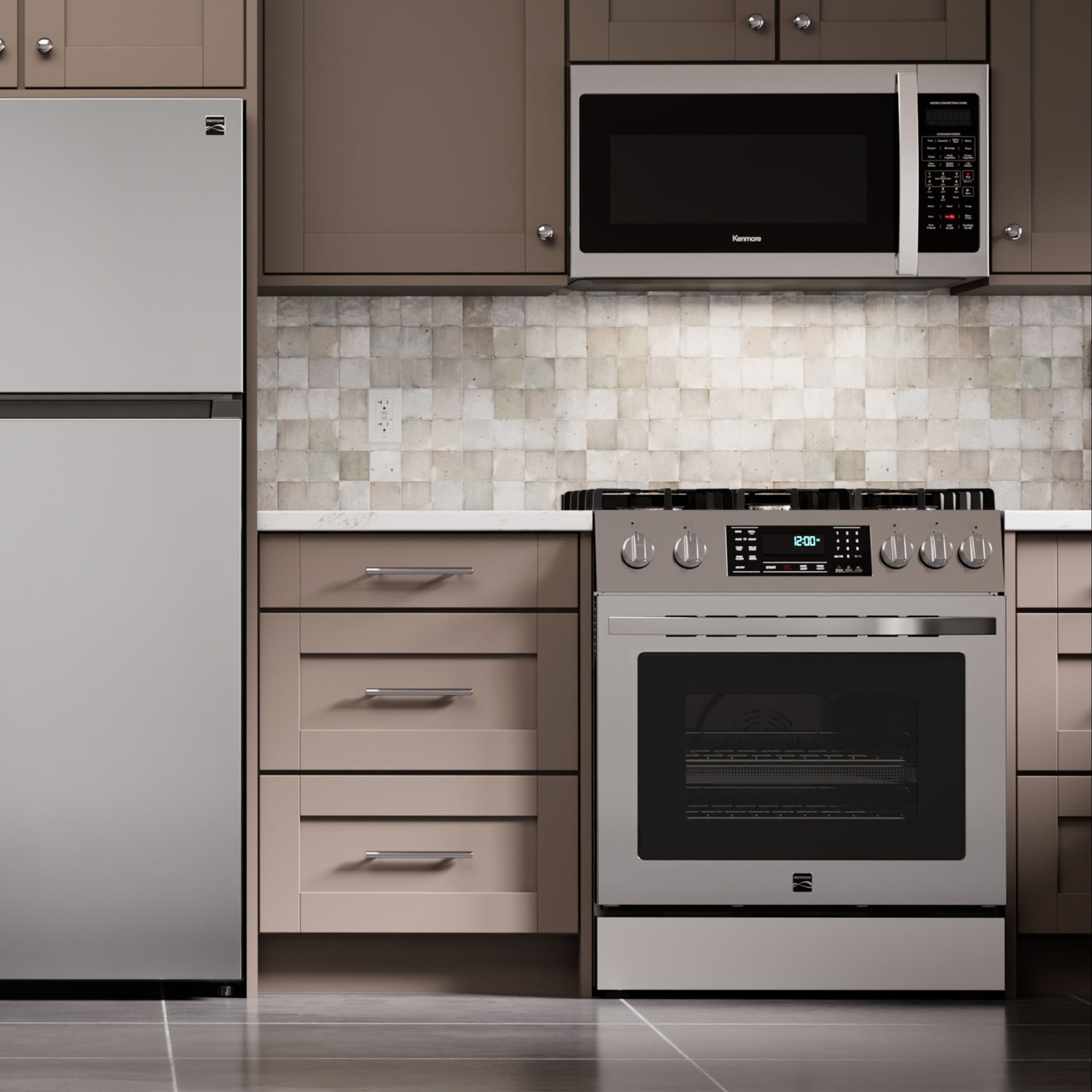 Kenmore stainless steel gas range installed in a light gray and beige kitchen