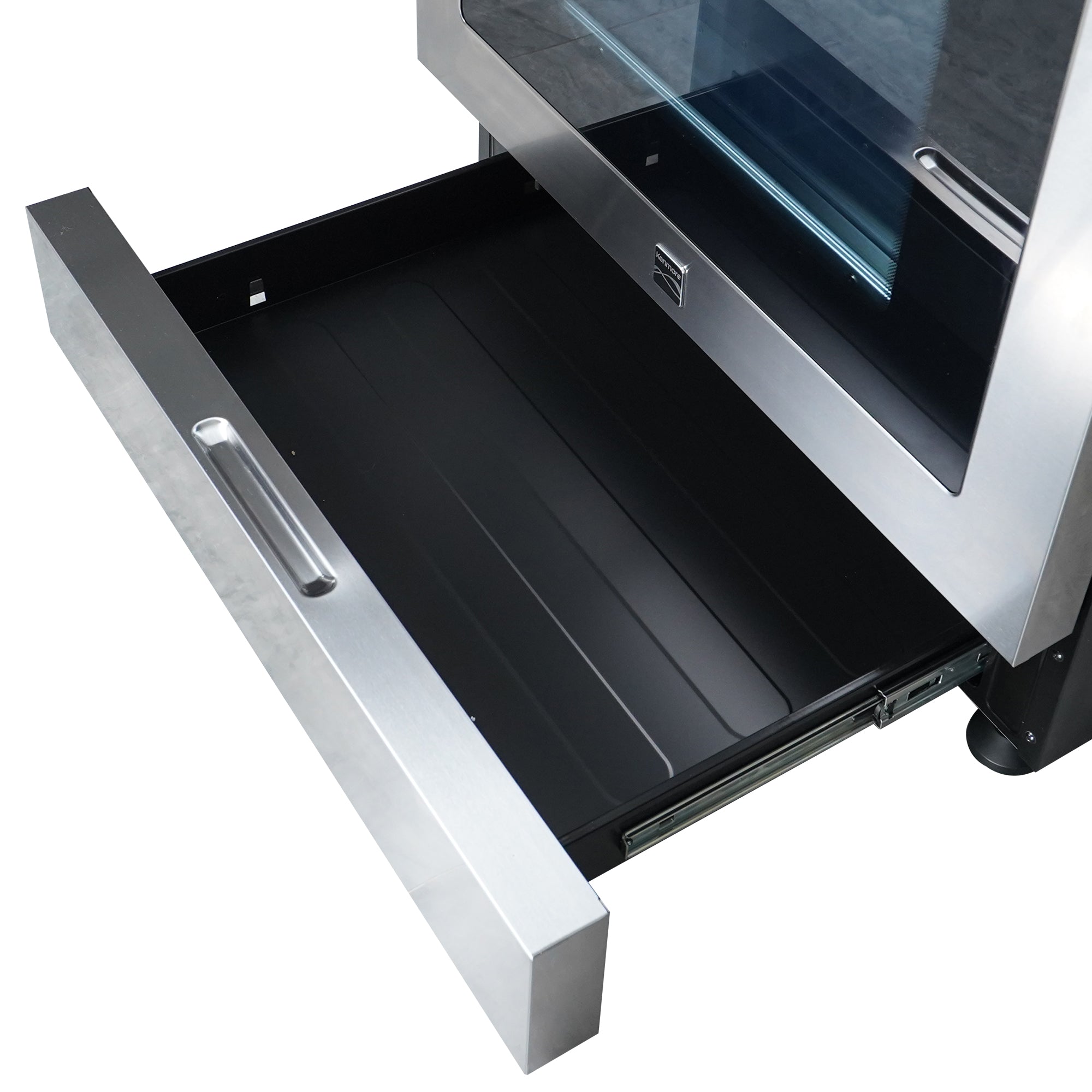 Closeup of the bottom portion of the Kenmore stainless steel gas range with the storage drawer pulled out