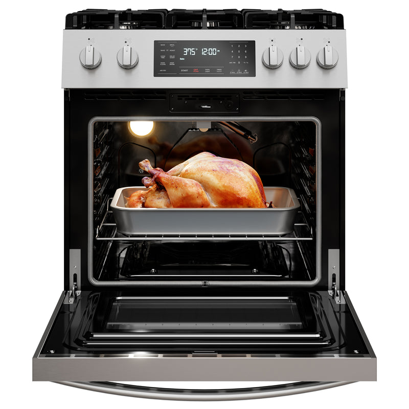 Kenmore stainless steel gas range open with a roast chicken inside