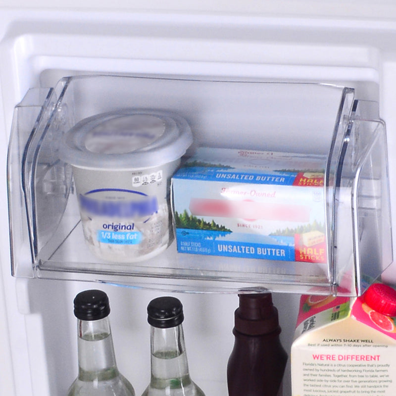Closeup of the dairy compartment in the door of the Kenmore stainless steel top mount refrigerator filled with food items