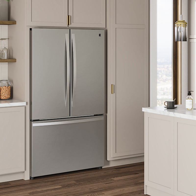 Kenmore 20.3 cu. ft. counter depth french door refrigerator in stainless steel installed in a light gray and beige kitchen