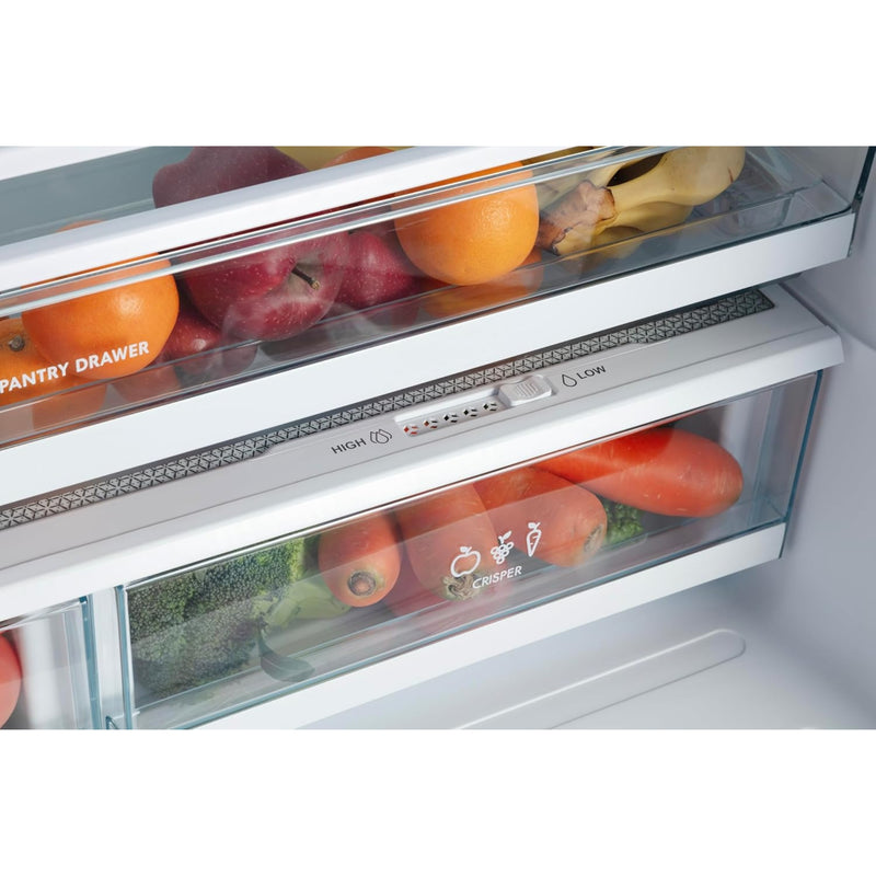 Closeup of the full-width pantry drawer and crispers in the Kenmore 20.3 cu. ft. counter depth french door refrigerator filled with fruits and vegetables