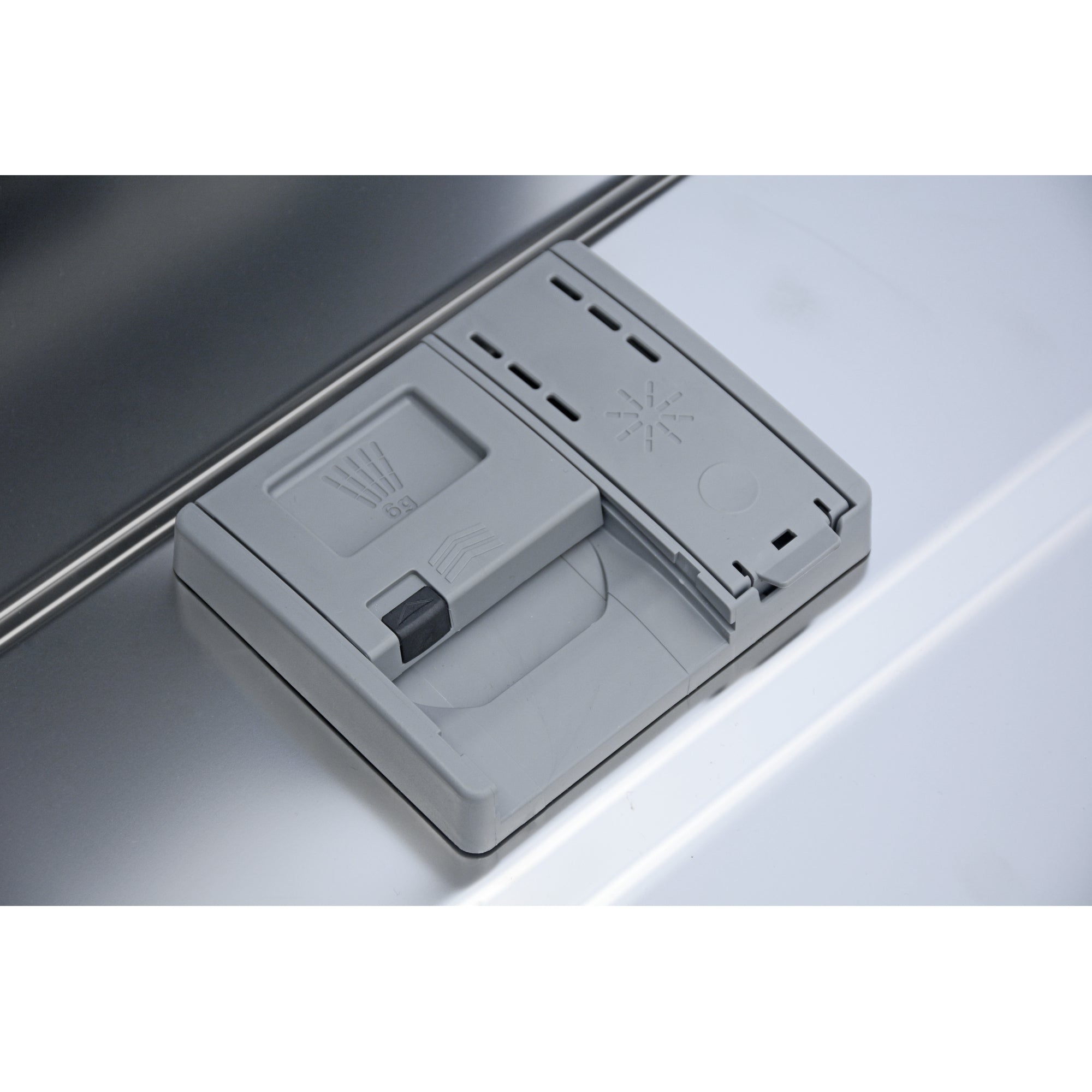 Closeup of the stainless steel interior of the Kenmore ultra-quiet 24-inch top control dishwasher showing the closed detergent compartment