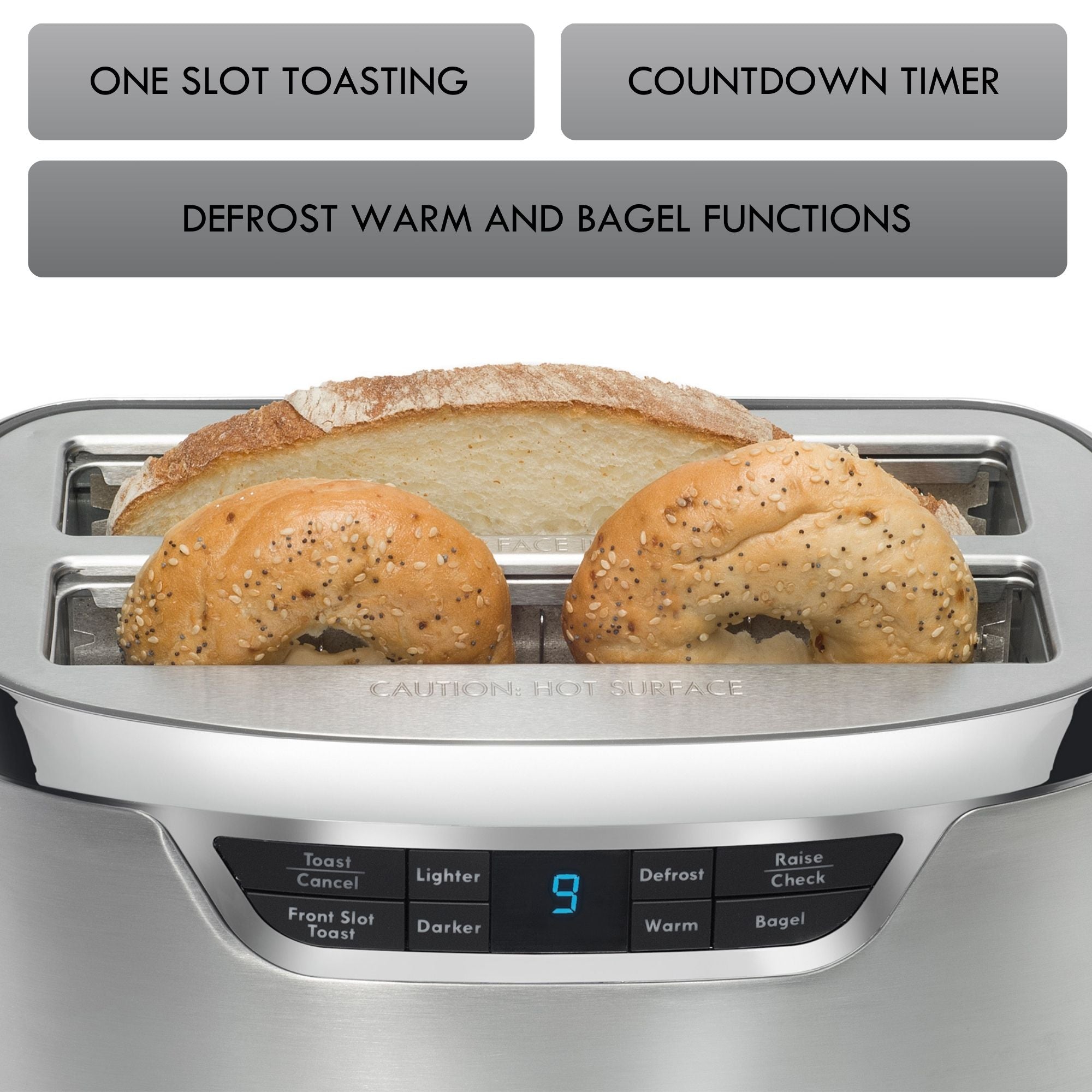 Kenmore Elite long slot stainless steel toaster with a wide slice of artisanal bread and two bagel halves inside and features listed above: One slot toasting; countdown timer; defrost warm and bagel functions