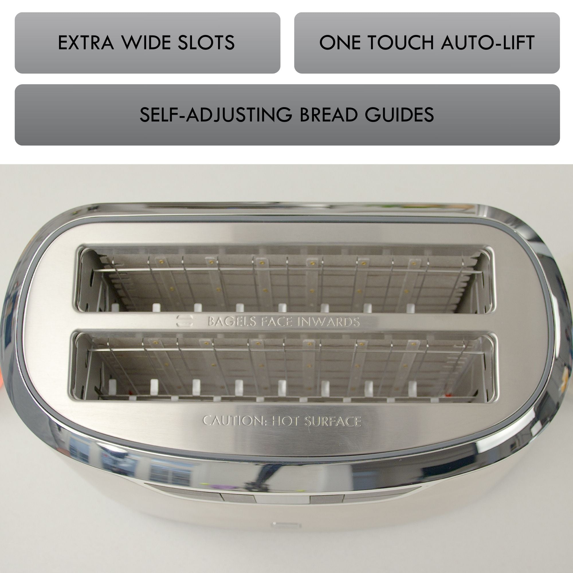 Top view into the empty Kenmore long-slot toaster with features listed above: Extra wide slots; one touch auto-lift; self-adjusting bread guides