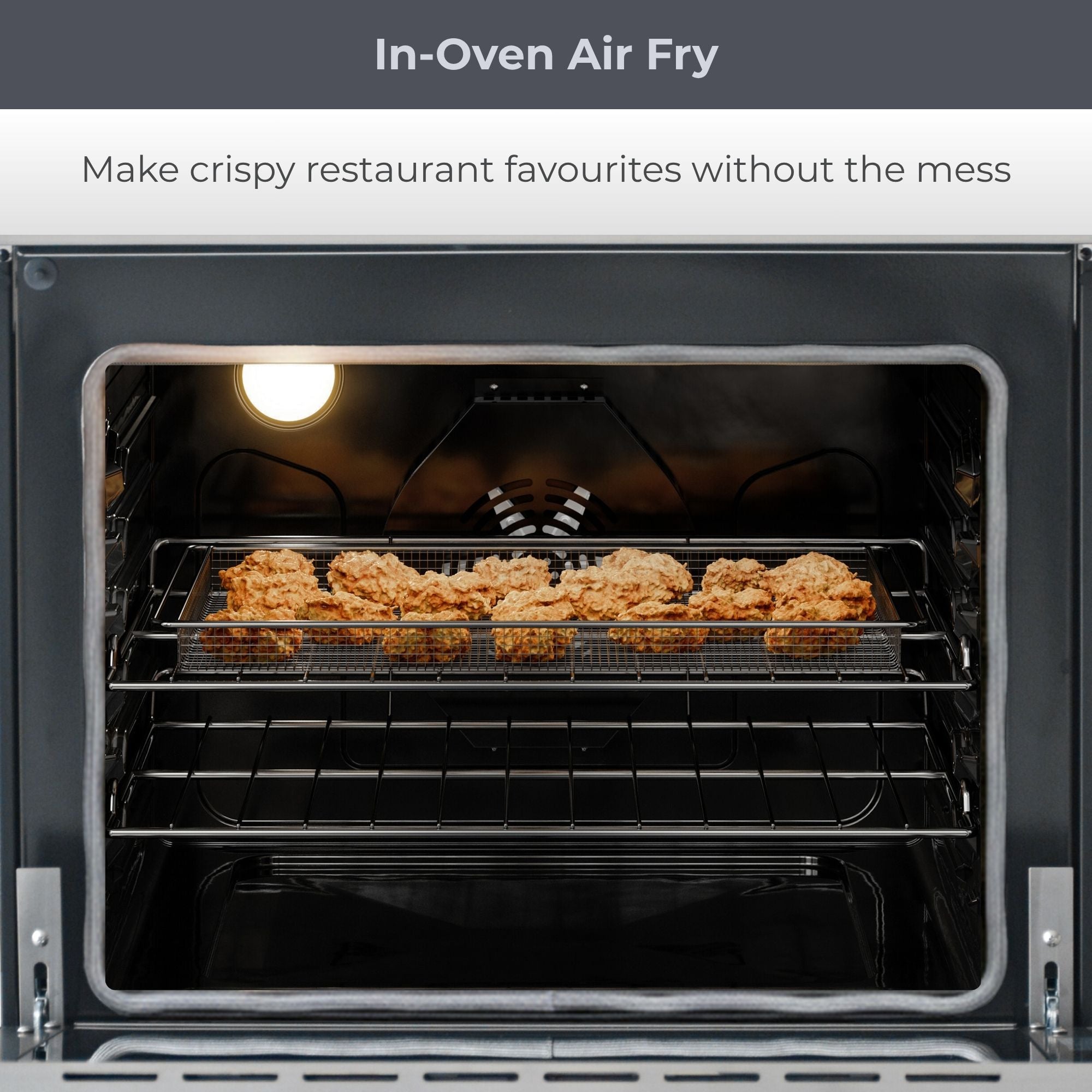 Closeup of oven interior with food cooking in the air fry basket. Text above reads, "In-Oven Air Fry: Make crispy restaurant favourites without the mess"