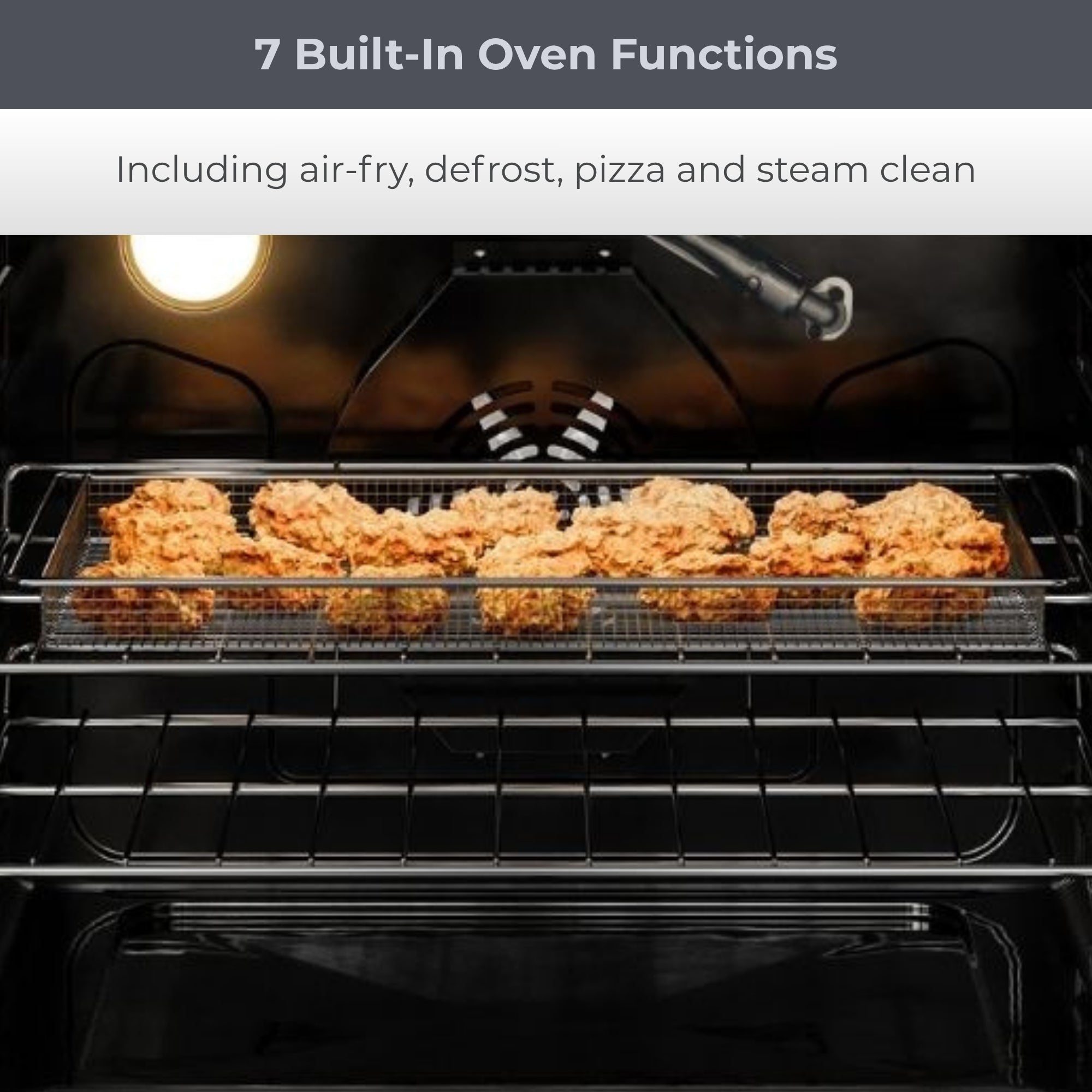 Closeup view of the open Kenmore PRO stainless steel front-control range with crispy chicken wings in the air fryer basket inside. Text above reads, "7 Built-In Oven Functions: Including air-fry, defrost, pizza and steam clean"