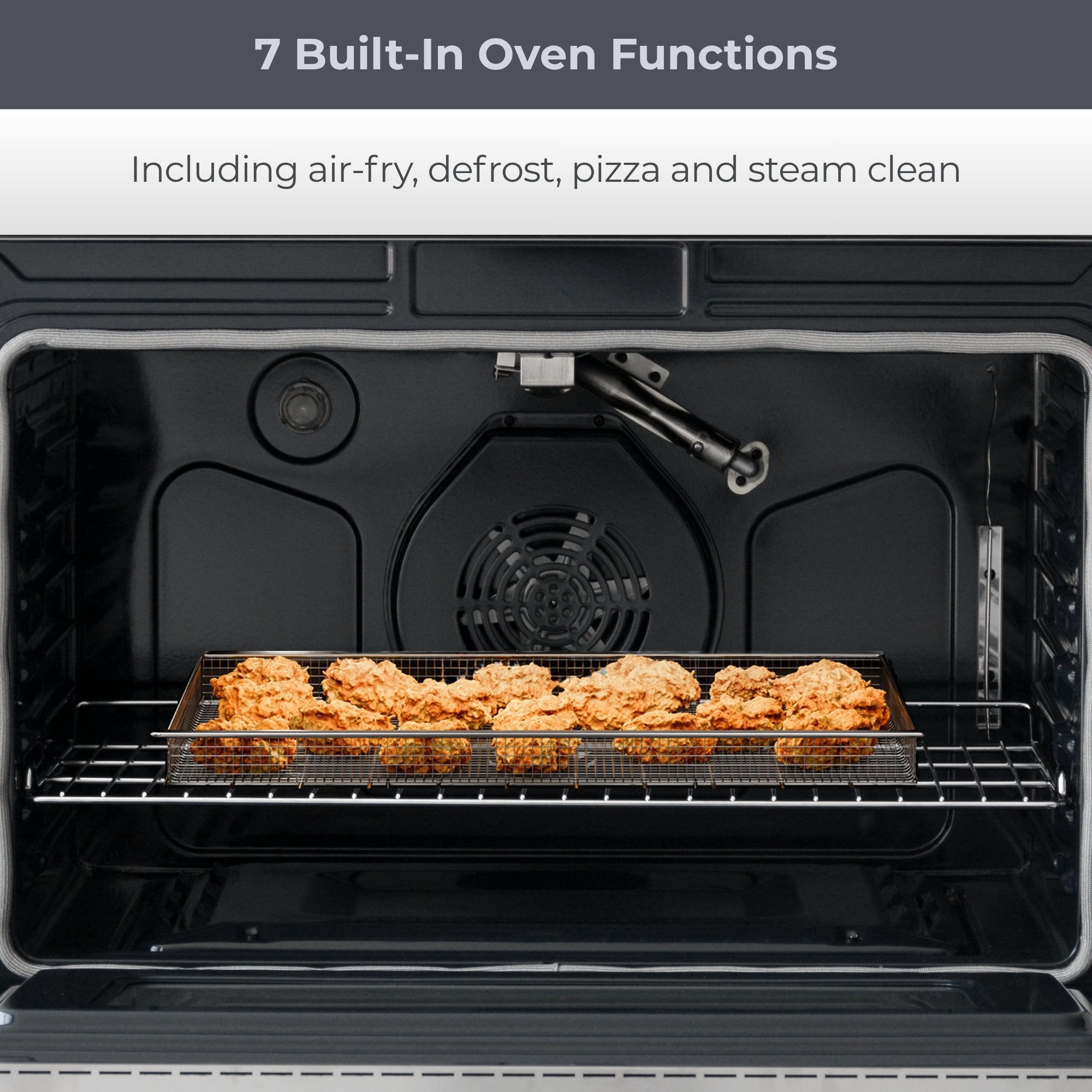 Closeup of oven interior with food cooking in air fryer basket. Text above reads, "7 Built-In Oven Functions: Including air-fry, defrost, pizza and steam clean"