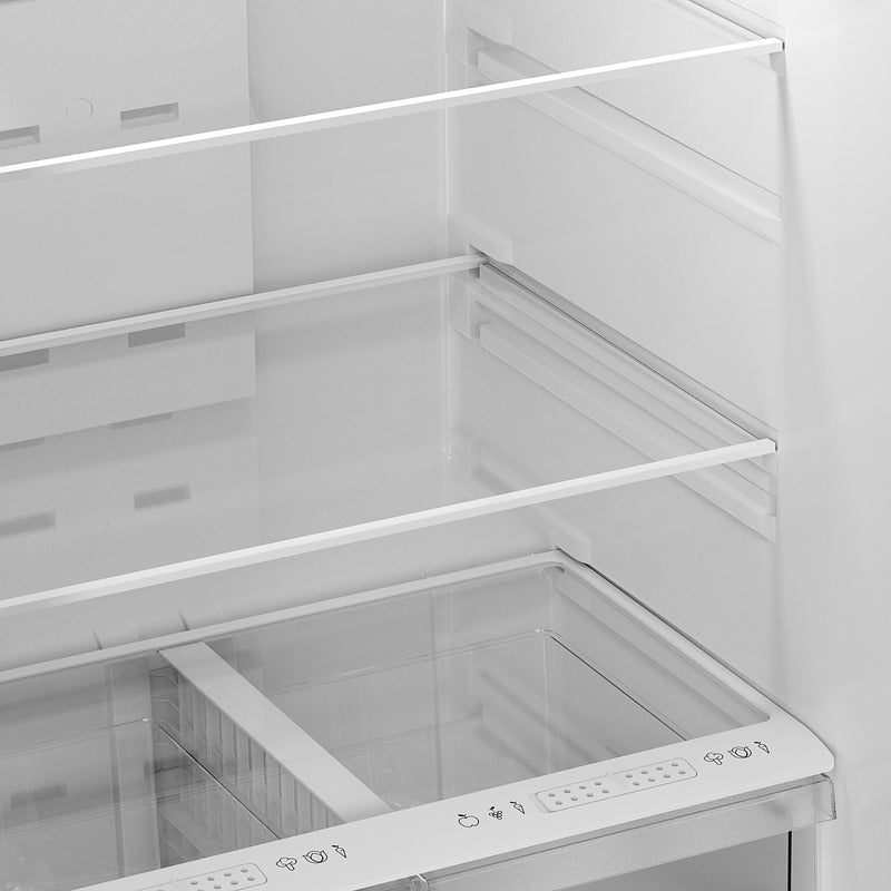 Closeup of inside the Kenmore metallic steel top mount refrigerator showing the tempered glass shelves