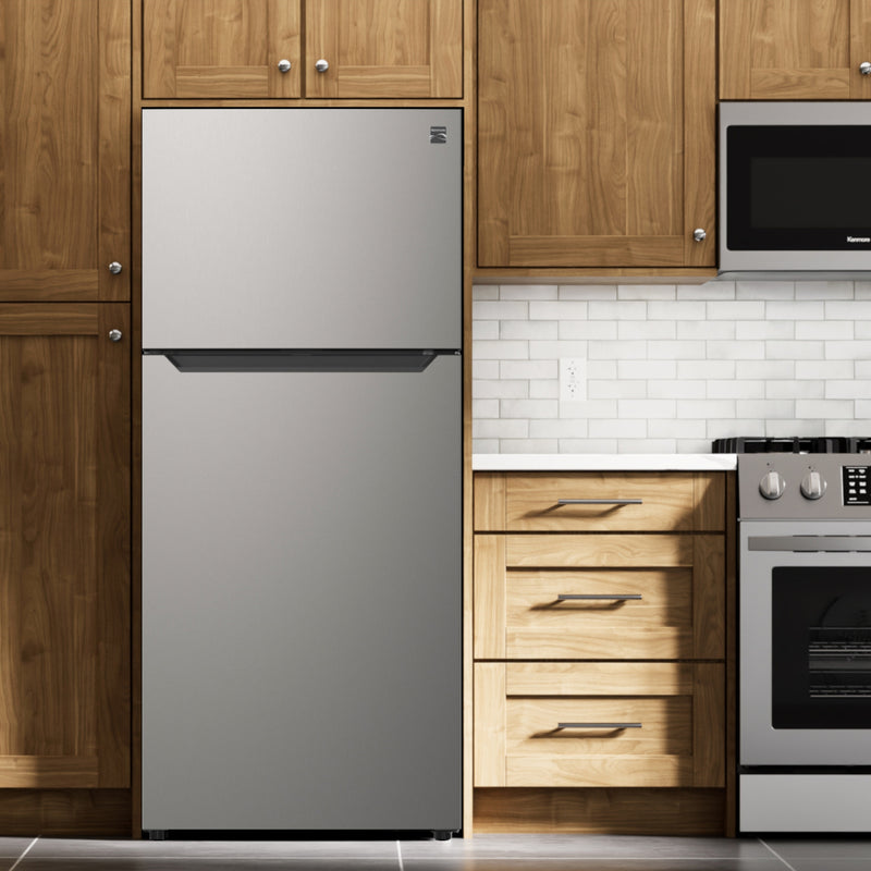 Kenmore 18.1 cu ft metallic steel top mount refrigerator, closed, in an elegant kitchen