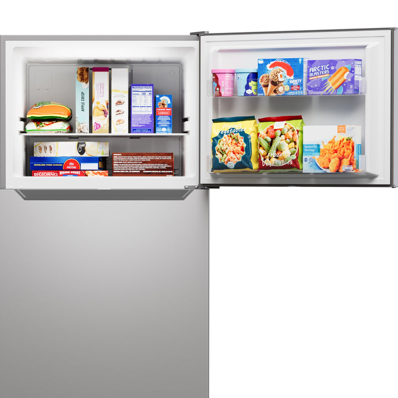 Closeup of the Kenmore metallic steel top mount refrigerator with the freezer open and filled with food