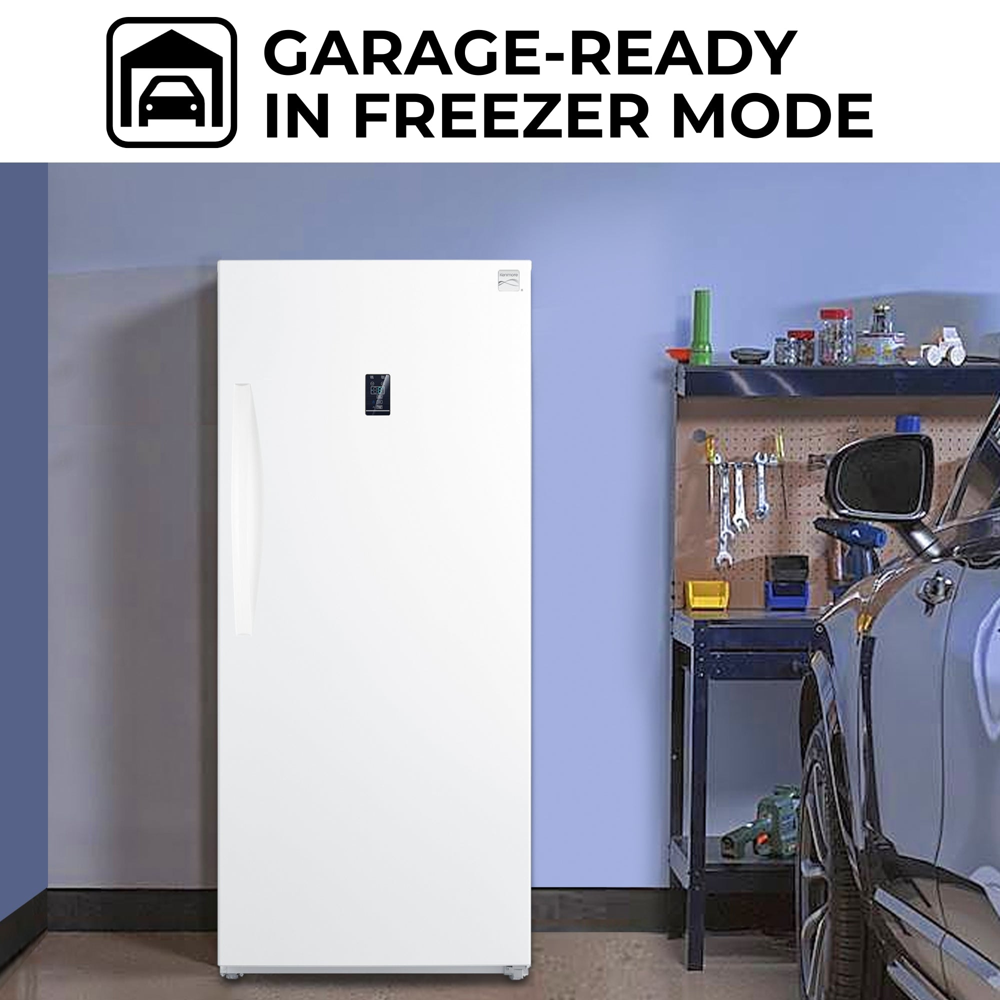Kenmore convertible upright freezer/refrigerator, closed, in a garage with a tool bench and car partly visible beside it. Text above reads, "Garage-ready in freezer mode"