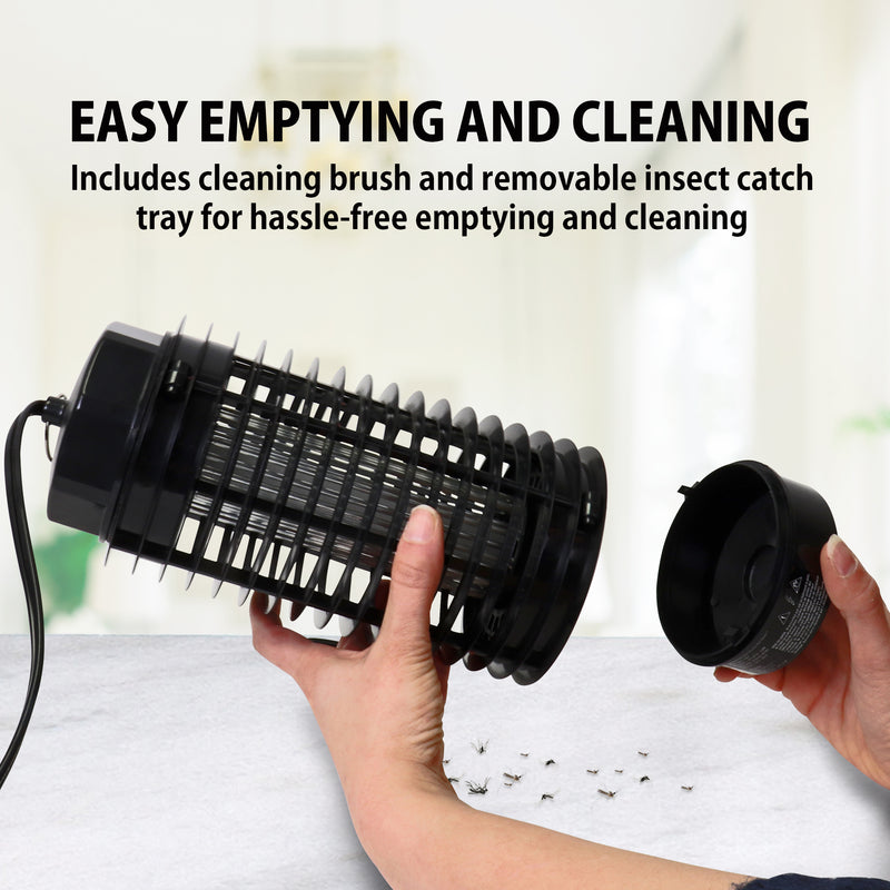 Lifestyle image of two hands holding the Bite Shield electronic flying insect zapper with the main portion in one hand and the catch cup in the left. There are dead mosquitoes on a white and gray marbled surface below the trap. Text above reads, "Easy emptying and cleaning: Includes cleaning brush and removable insect catch tray for hassle-free emptying and cleaning"