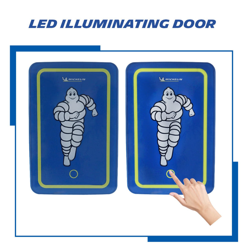 Two side-by-side product shots on a white background show front views of 6 can Michelin mini fridge. Left image shows door light off and right image shows a person’s hand touching the power button and the door light on. Text above reads “LED illuminating door”