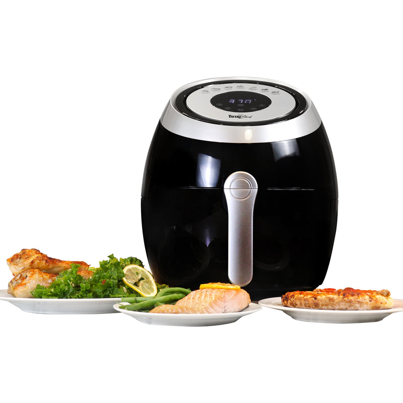 Product shot of Total Chef air fryer with plates of cooked food arranged around it on a white background