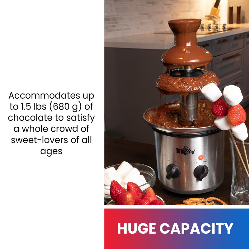 Lifestyle image of chocolate fountain filled with melted chocolate with skewers and bowls of strawberries and marshmallows on either side. Text below reads “Huge capacity” and text to the left reads, “Accommodates up to 1.5 lbs (680 g) of chocolate to satisfy a whole crowd of sweet-lovers of all ages”